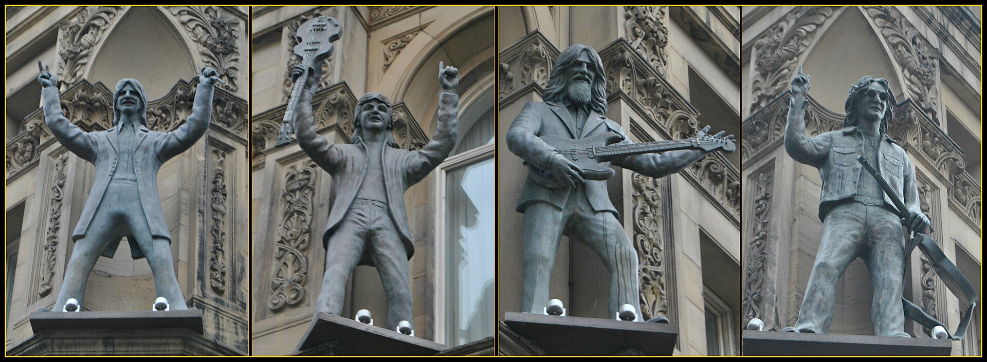 The four Beatles statues in niches high on the facade of the Hard Days Night Hotel, North John Street, Liverpool