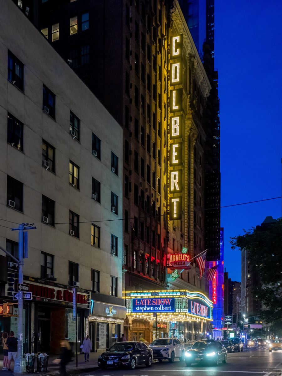 The Ed Sullivan Theater marquee on Broadway, New York City, lit at night in June 2019