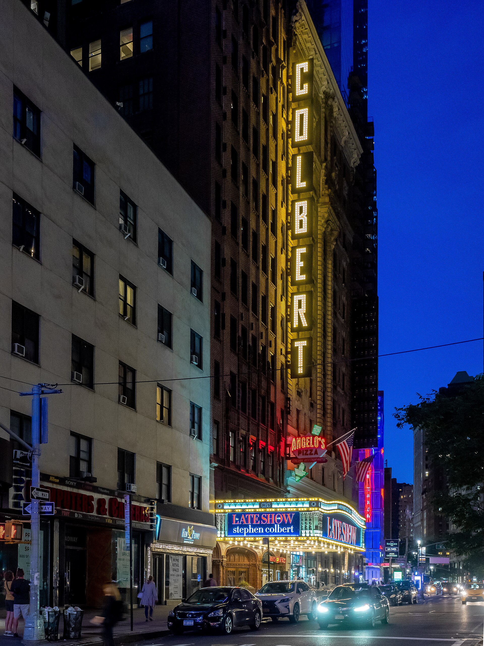 The Ed Sullivan Theater marquee on Broadway, New York City, lit at night in June 2019