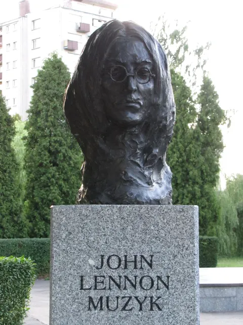 Bronze bust of John Lennon on a granite pedestal in the Aleja Sław, Kielce, photographed in June 2011