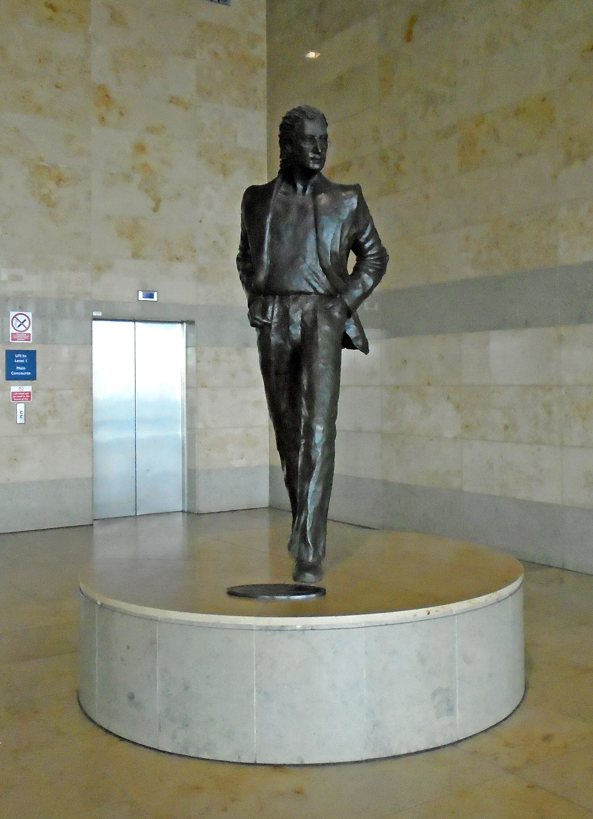 Tom Murphy's bronze John Lennon statue on the upper floor of the terminal at Liverpool John Lennon Airport