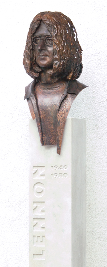 Copper bust of John Lennon by László Szlávics Jr. on a limestone column at the music school in Sopron, Hungary