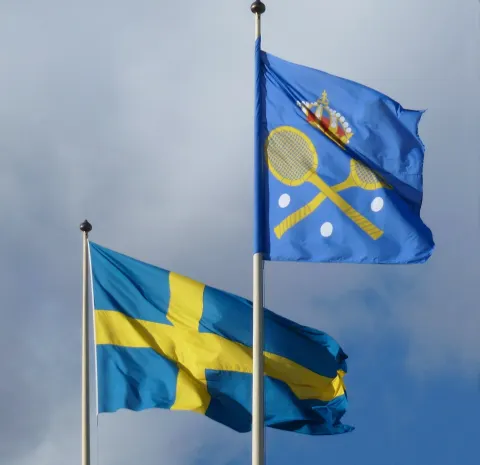 Exterior of Kungliga tennishallen on Lidingövägen in Stockholm with flags flying