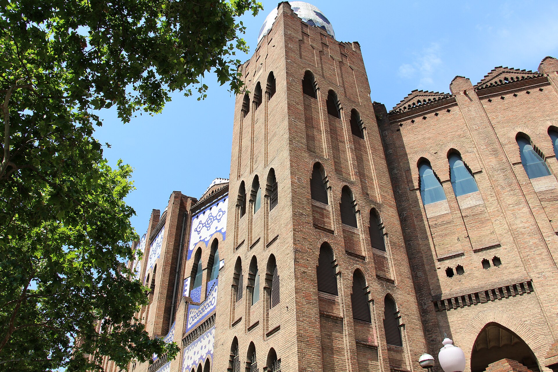 Brick and tiled facade of La Monumental bullring on Gran Via in Barcelona