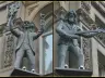 The four Beatles statues in niches high on the facade of the Hard Days Night Hotel, North John Street, Liverpool