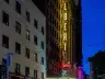 The Ed Sullivan Theater marquee on Broadway, New York City, lit at night in June 2019