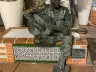 Carmen Mudarra's bronze statue of John Lennon playing guitar in Plaza Flores, Almería