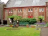 Bronze statue of Linda McCartney holding a lamb in the Linda McCartney Memorial Garden, Campbeltown
