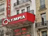 Illuminated Olympia sign and frontage on the boulevard des Capucines in Paris, 2018