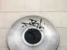 Record-shaped metal disc and marble street sign on a wall of Placa de John Lennon in Gracia, Barcelona
