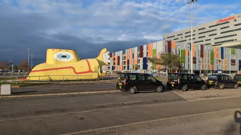 The steel Yellow Submarine sculpture at the entrance to Liverpool John Lennon Airport, photographed in February 2023